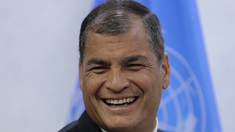 Rafael Correa posing for cameras