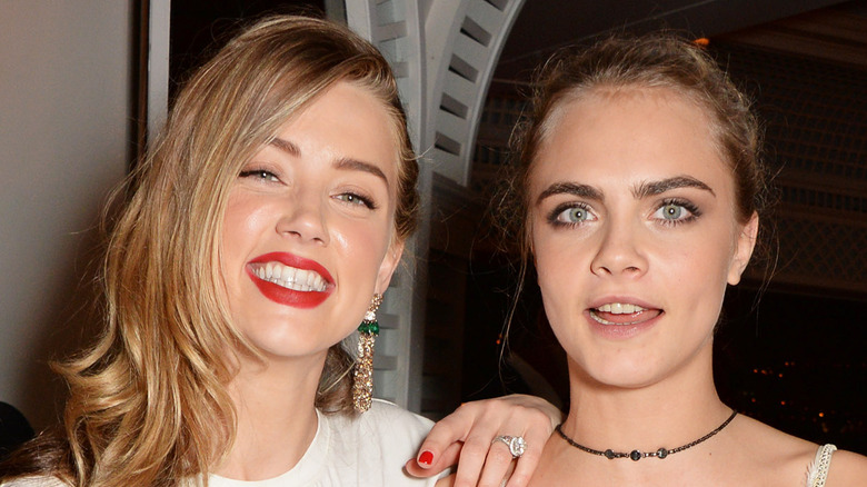 Amber Heard and Cara Delevingne posing