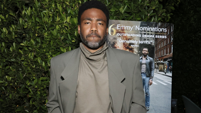 Donald Glover in a gray suit