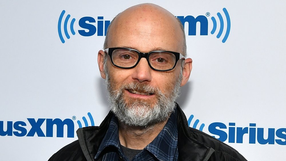 Moby with thick black-framed glasses