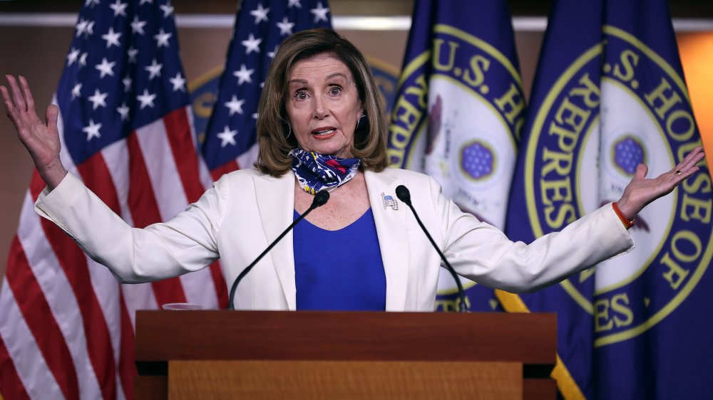 Nancy Pelosi talks to the press