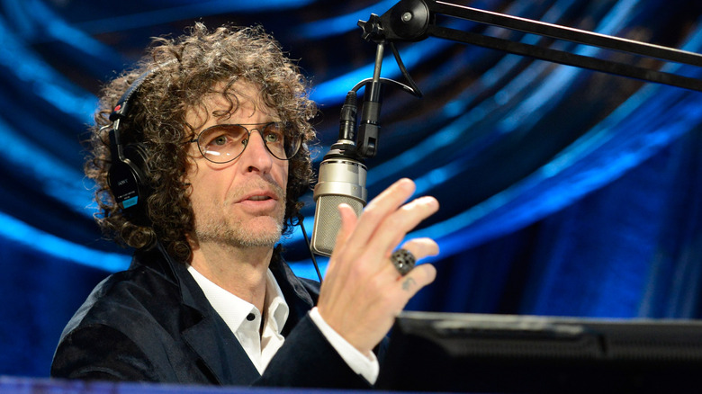 Howard Stern speaking into a microphone