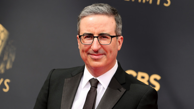 John Oliver smiling at the Emmys