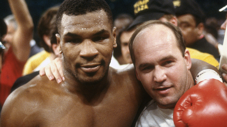 Mike Tyson and Kevin Rooney, arm in arm