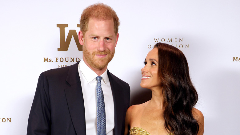 Prince Harry and Meghan Markle posing