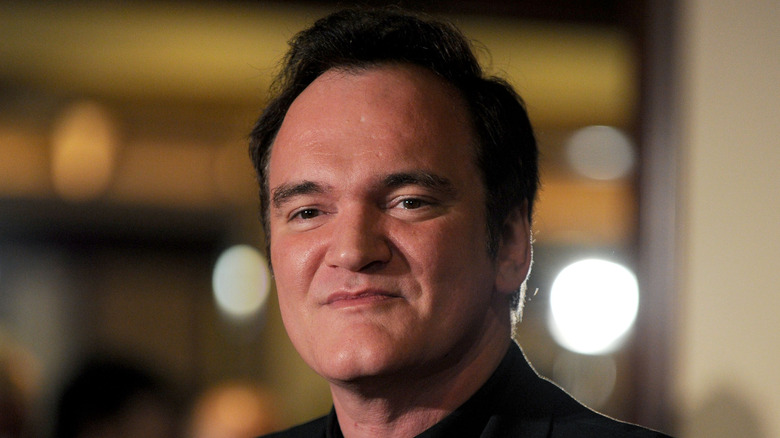 Quentin Tarantino posing for cameras