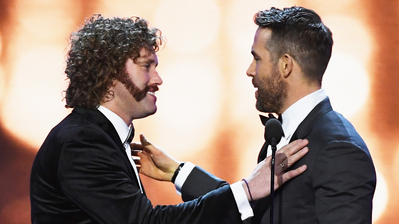 T.J. Miller and Ryan Reynolds standing together