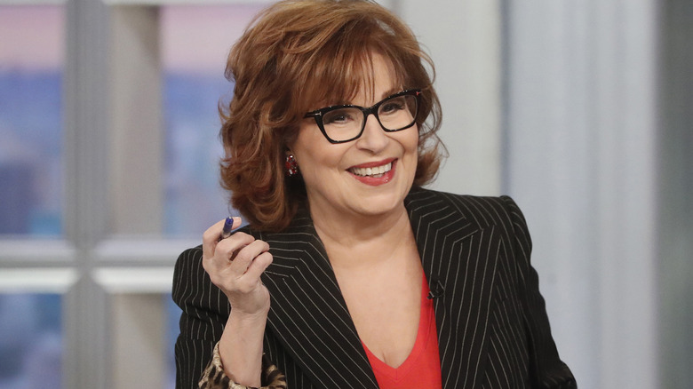 Joy Behar holding pen on The View and smiling