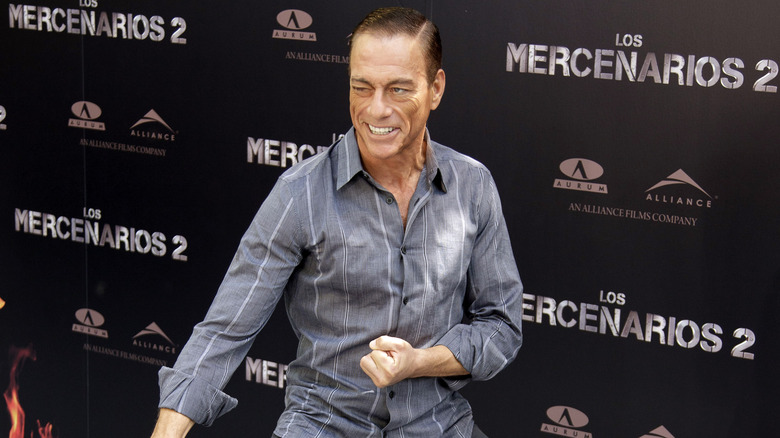 Jean Claude Van Damme striking martial arts pose at a premiere