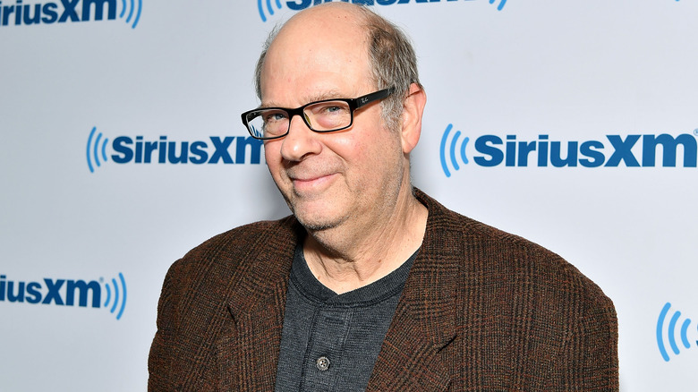 Stephen Tobolowsky grinning at event in tweed jacket