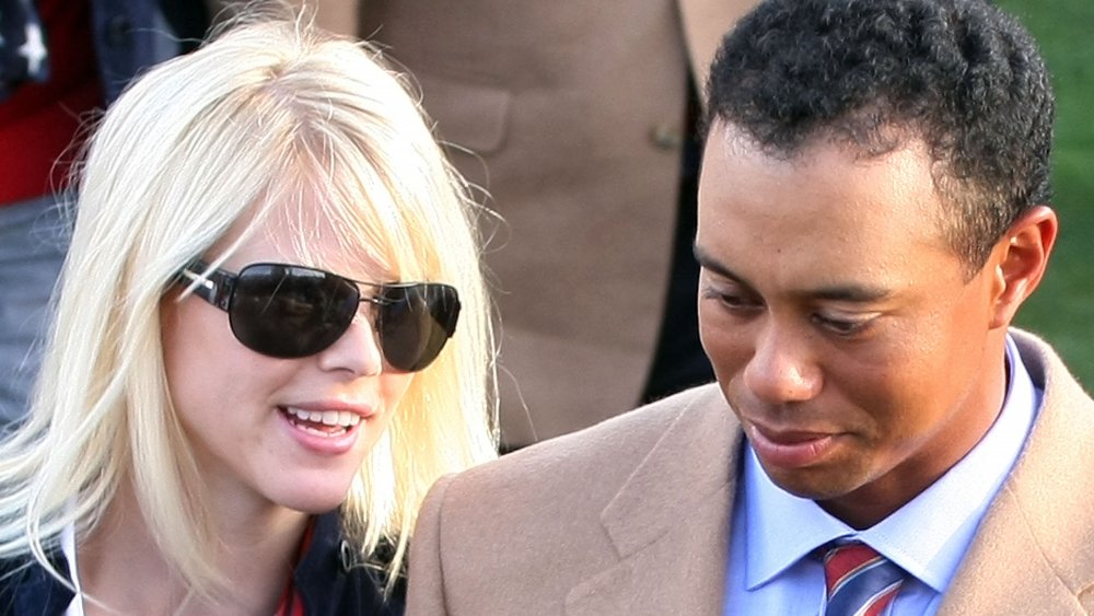 Elin Nordegren and Tiger Woods side by side