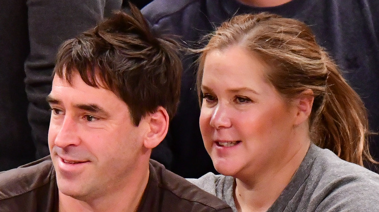 Chris Fischer and Amy Schumer at an event