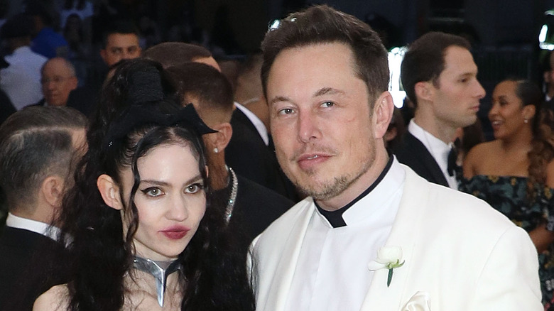 Grimes and Elon Musk posing