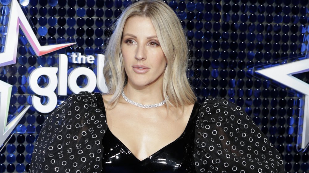 Ellie Goulding in a black latex dress with puffy sleeves