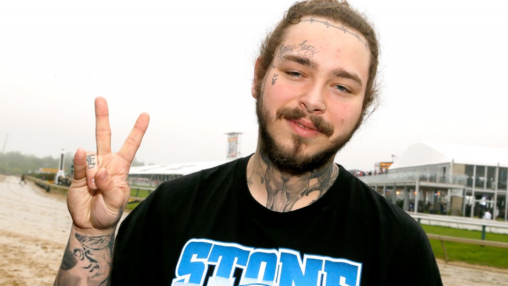 Post Malone giving a peace sign