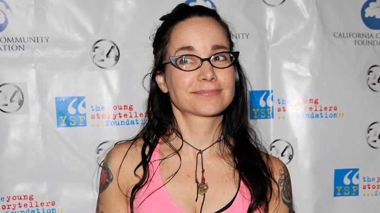 Janeane Garofolo wearing a pink tank top