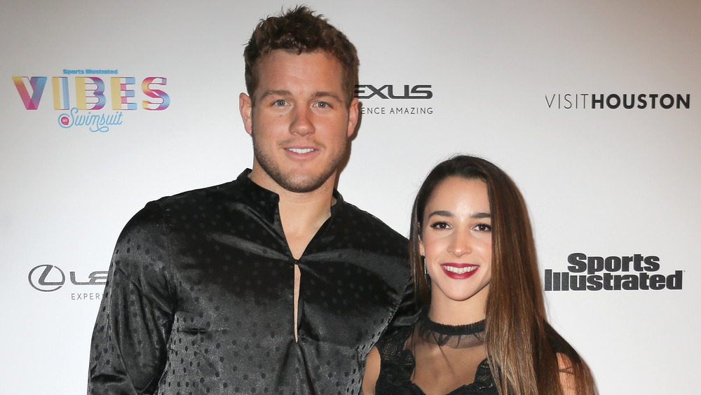 Colton Underwood and Aly Raisman smiling together 