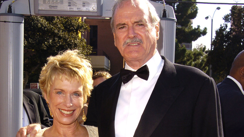 John Cleese and Alyce Cleese posing outdoors