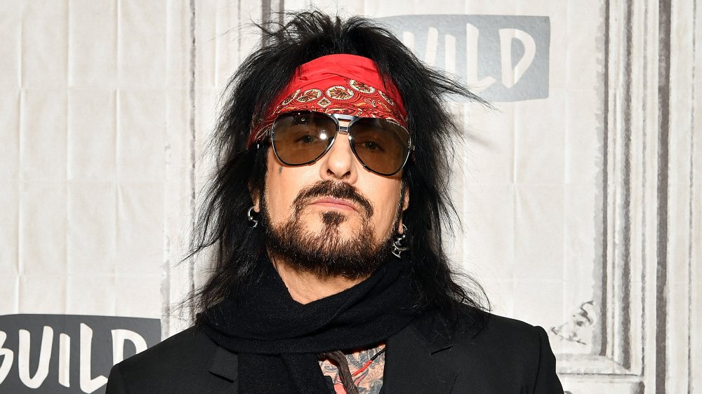 Nikki Sixx with red bandana in hair and black sunglasses