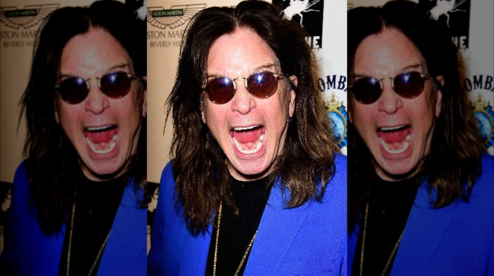 Ozzy Osbourne with sunglasses on, screaming