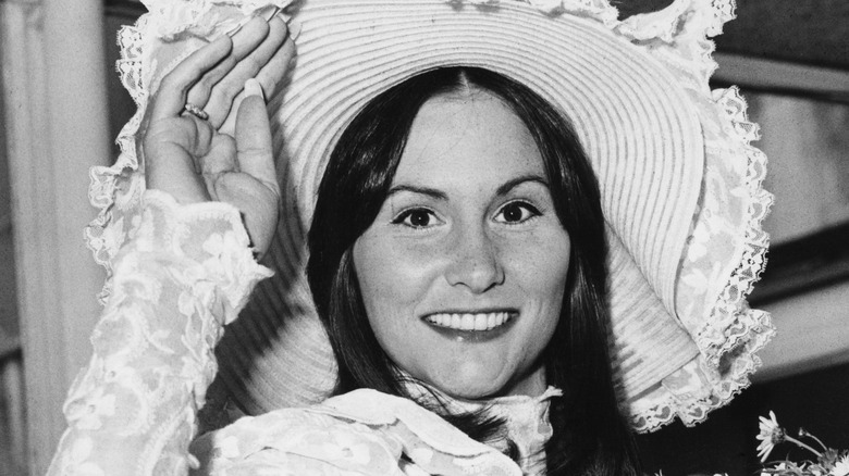 Linda Lovelace wearing a hat