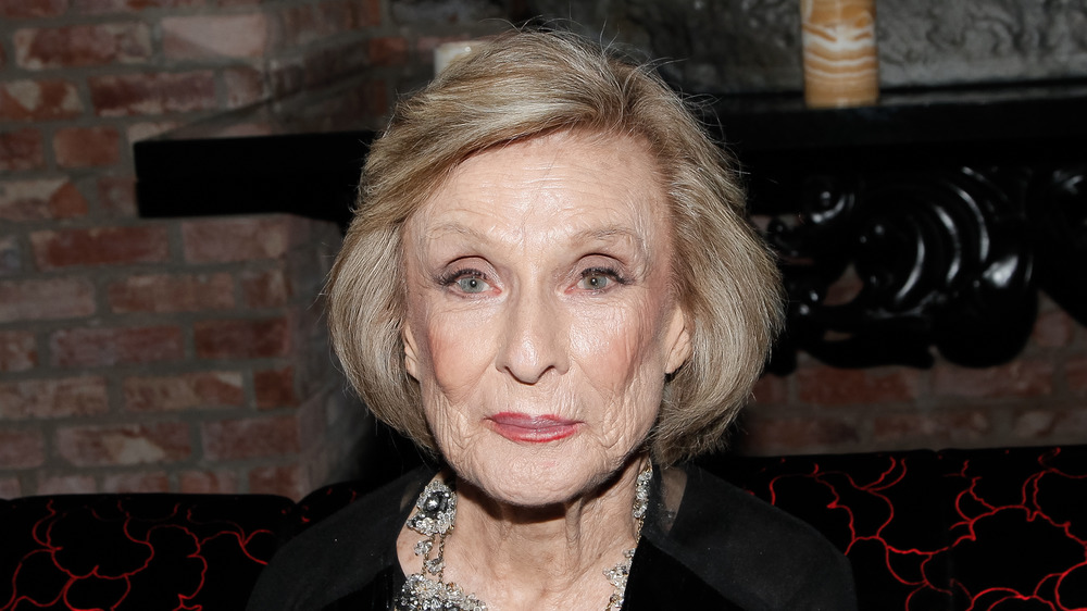 Cloris Leachman smiles with her lips closed