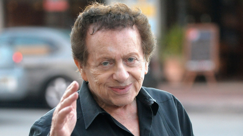 Jackie Mason smiling and waving 