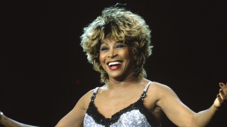 Tina Turner performs silver dress