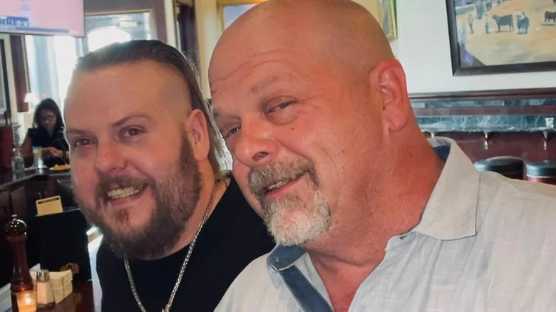 Rick Harrison and Adam Harrison sit in restaurant