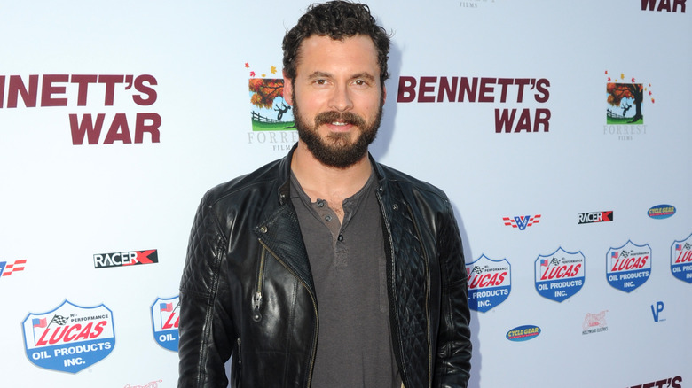 Adan Canto wearing black