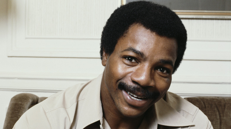 Carl Weathers tan shirt smiling