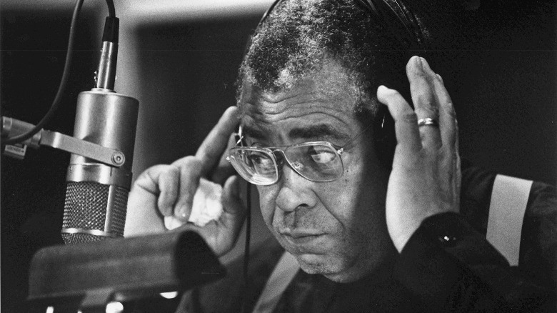 James Earl Jones adjust his headphones during a recording at a studio in Hollywood, CA (1991)