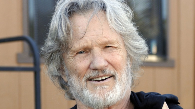 Kris Kristofferson with wavy gray hair and a beard