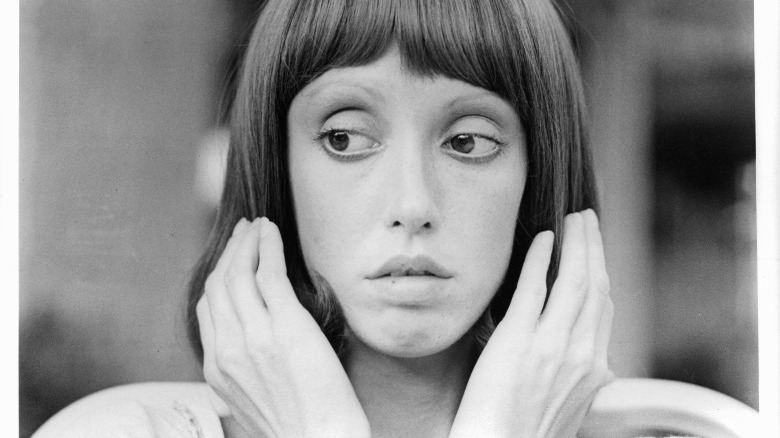 Shelley Duvall with hands to hair in a scene from the film "3 Women" (1977)