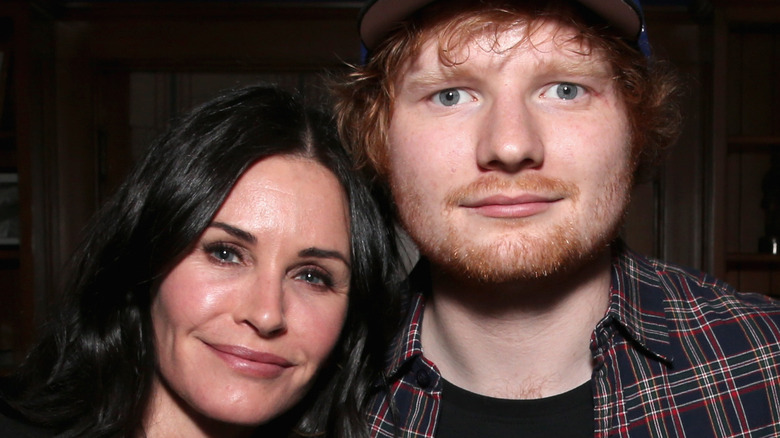 Courteney Cox with head on Ed Sheeran's shoulder