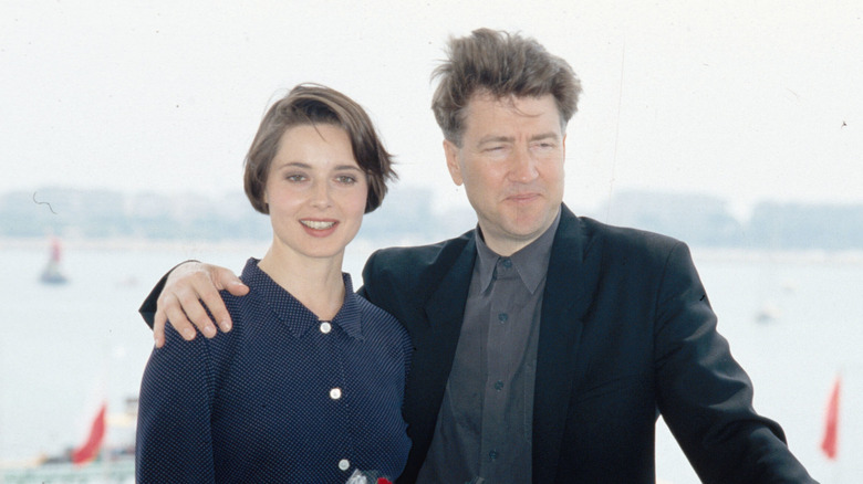 David Lynch and Isabella Rossellini posing in front of water