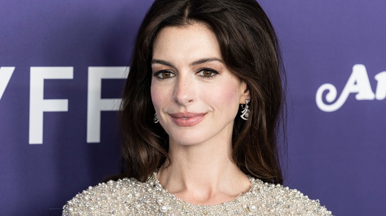 Anne Hathaway smiling at an event 