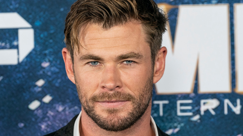 Chris Hemsworth smiling at an event 