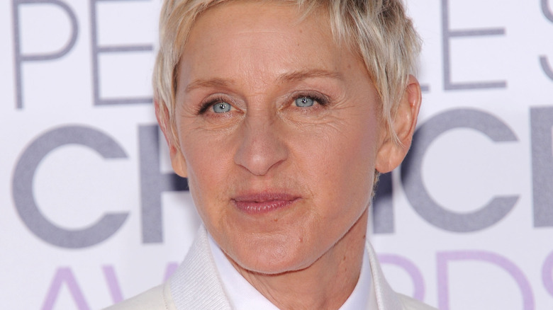 Ellen DeGeneres smiling at an event 