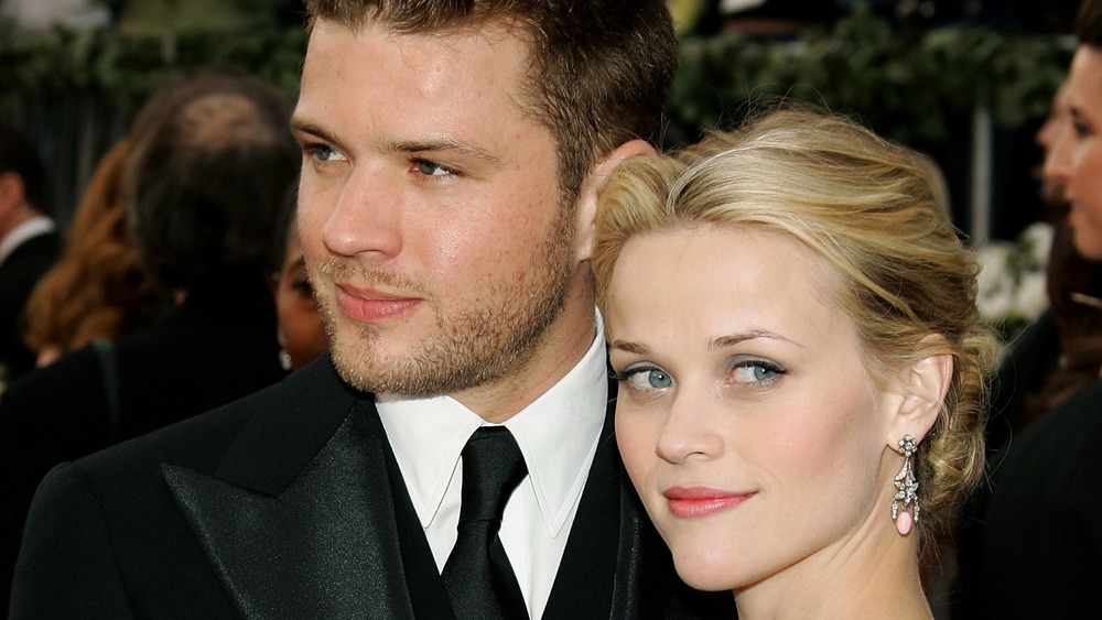 Ryan Phillippe and Reese Witherspoon looking in different directions