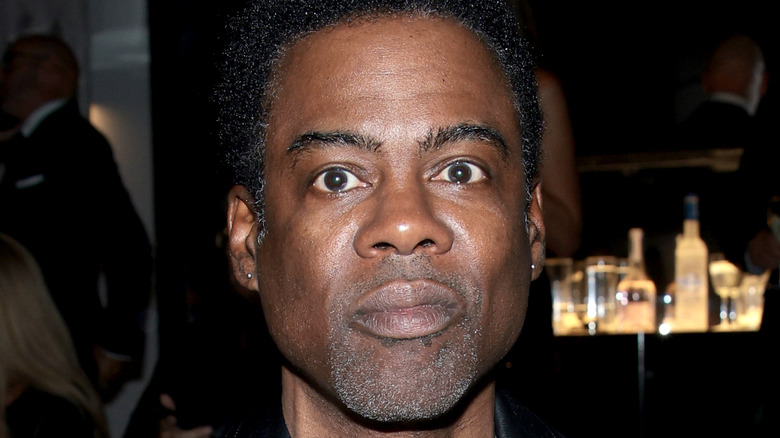 Chris Rock posing for cameras