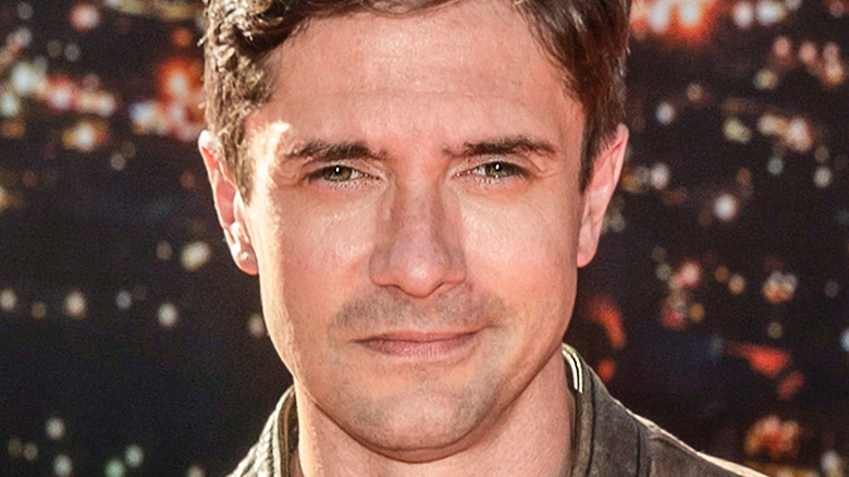 Topher Grace posing for cameras