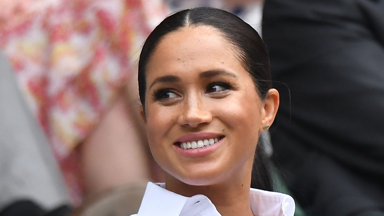 Meghan Markle smiling at Wimbledon