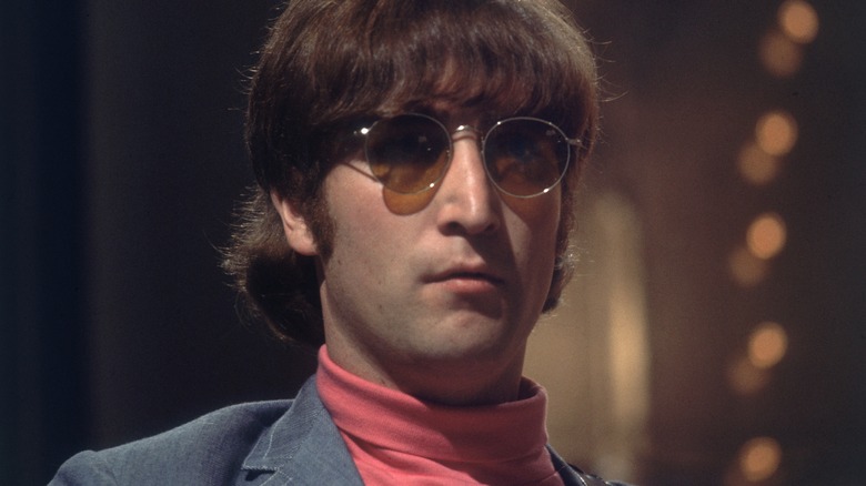 John Lennon posing 