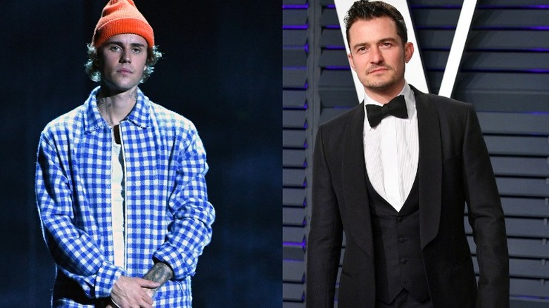 Justin Bieber and Orlando Bloom frowning 