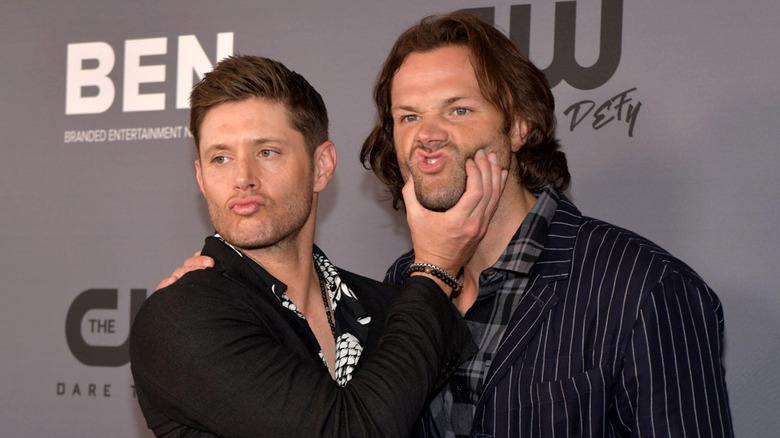 Jensen Ackles squeezing Jared Padalecki's face at The CW's Summer 2019 TCA Party