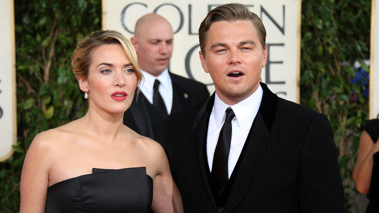 Kate Winslet and Leonardo DiCaprio with shocked expressions at the 66th Annual Golden Globe Awards