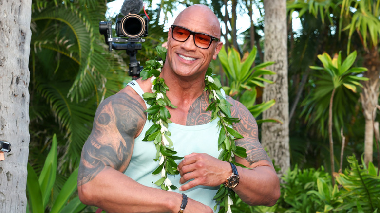 Dwayne Johnson wearing a lei outdoors at the "Moana 2" premiere