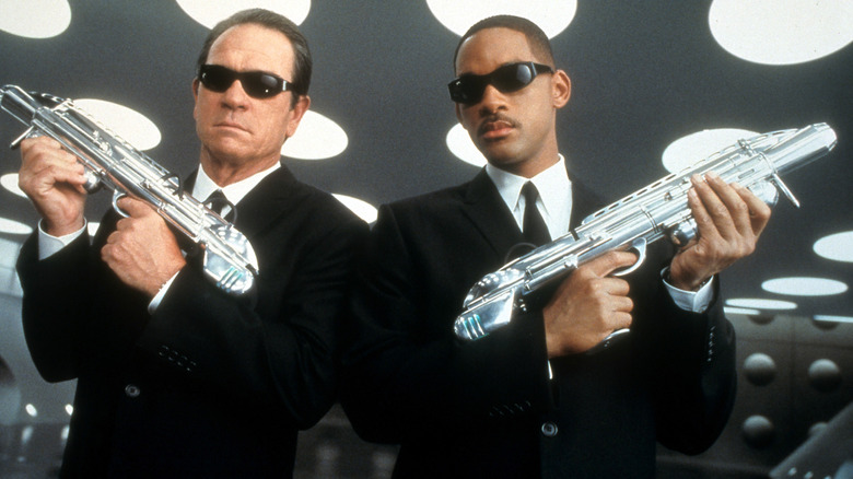 Tommy Lee Jones and Will Smith dressed as their "Men in Black" characters