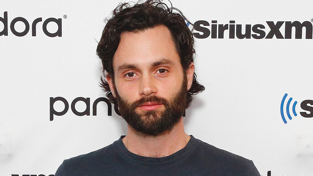 Penn Badgley looking at camera